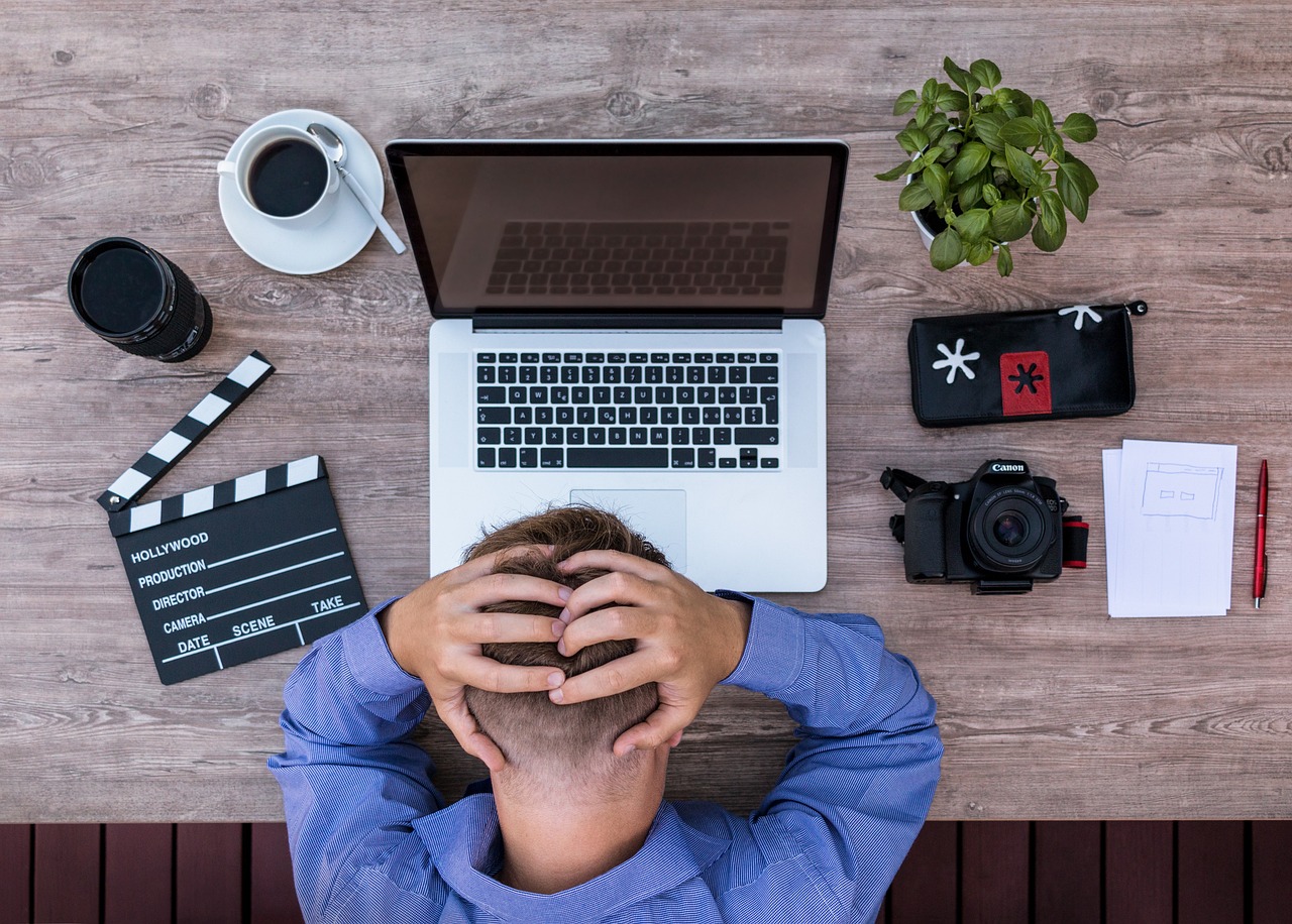 Creative professional facing challenges at desk